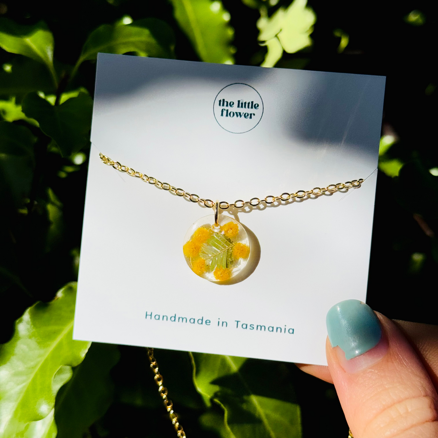 Native Wattle Necklace displayed with eco-friendly packaging – handmade Australian botanical jewellery, close up image